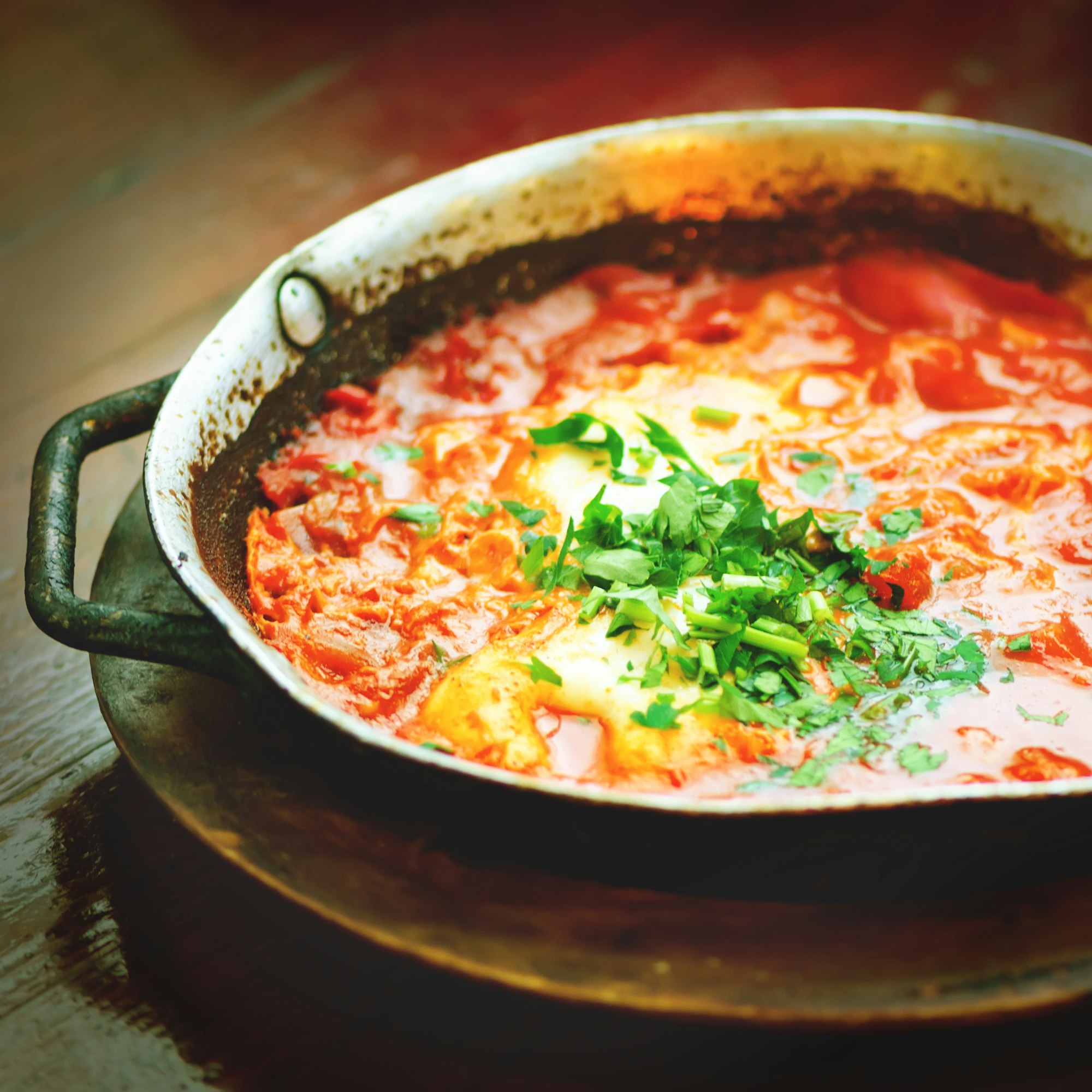 Shakshuka. Traditional jewish food and middle eastern cuisine recipe. Fried eggs, tomatoes, bell